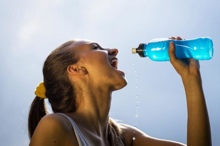 Woman drinking from a water bottle
